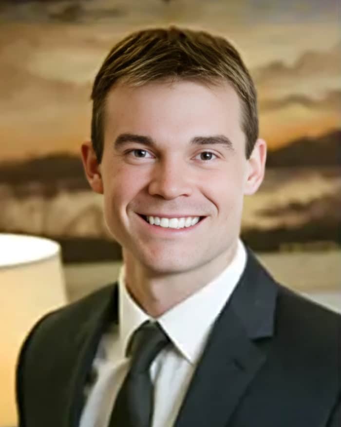 A headshot of Adam Cook, an attorney at Everett Cook Law.